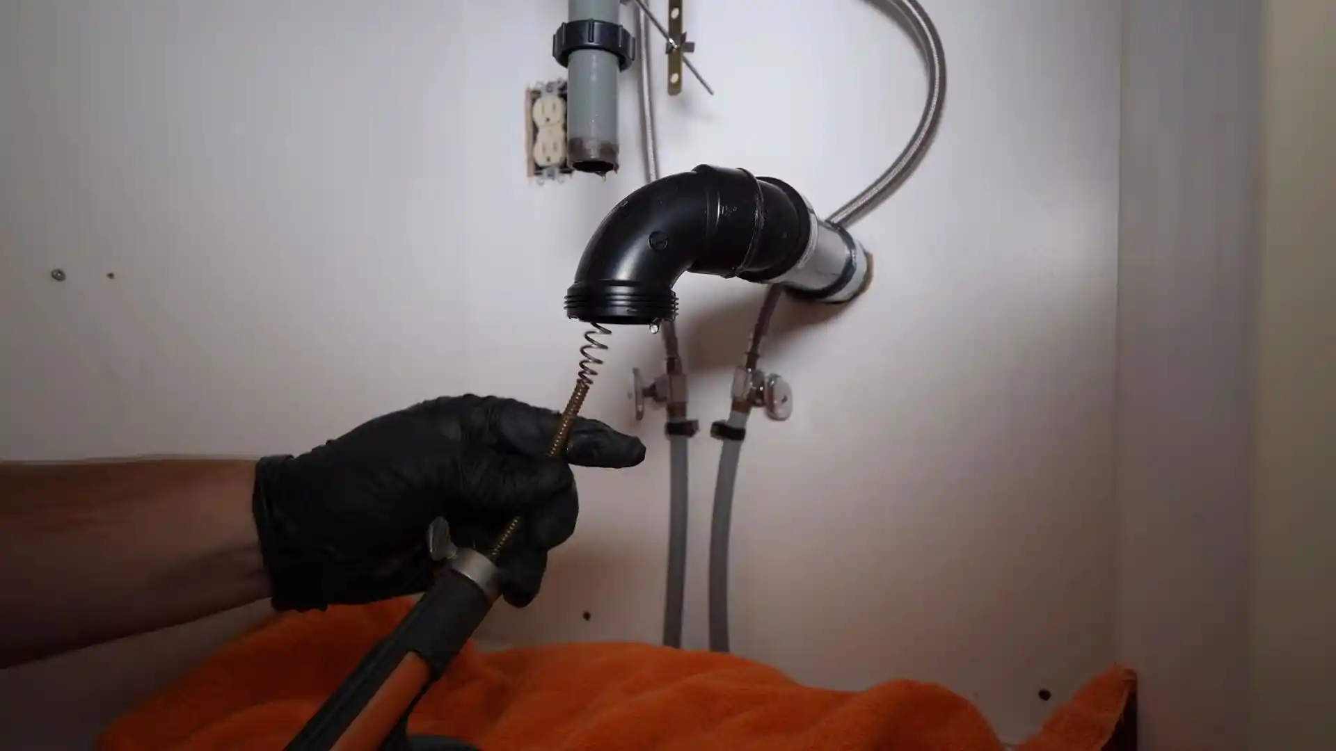 Sewage backup cleanup equipment near a basement floor drain in Montgomery Village, MD